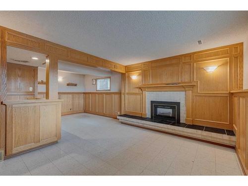 106 Huntham Place Ne, Calgary, AB - Indoor With Fireplace