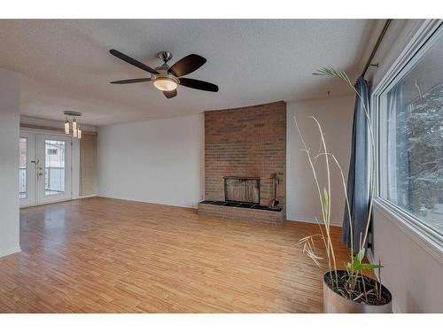 106 Huntham Place Ne, Calgary, AB - Indoor With Fireplace