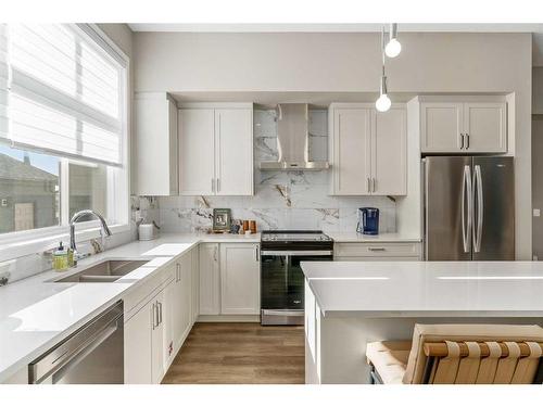 1119 Mahogany Boulevard Se, Calgary, AB - Indoor Photo Showing Kitchen With Double Sink With Upgraded Kitchen