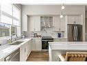 1119 Mahogany Boulevard Se, Calgary, AB  - Indoor Photo Showing Kitchen With Double Sink With Upgraded Kitchen 