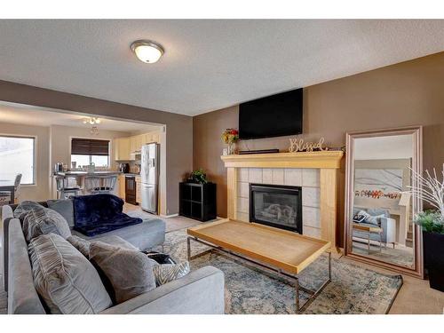 88 Covepark Way Ne, Calgary, AB - Indoor Photo Showing Living Room With Fireplace