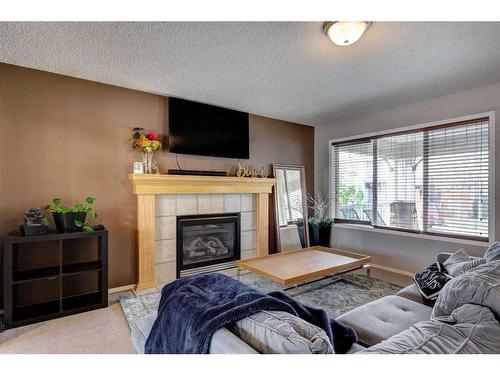 88 Covepark Way Ne, Calgary, AB - Indoor Photo Showing Living Room With Fireplace