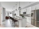 102-4150 Seton Drive Se, Calgary, AB  - Indoor Photo Showing Kitchen With Stainless Steel Kitchen With Upgraded Kitchen 