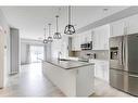 102-4150 Seton Drive Se, Calgary, AB  - Indoor Photo Showing Kitchen With Stainless Steel Kitchen With Upgraded Kitchen 