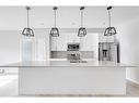 102-4150 Seton Drive Se, Calgary, AB  - Indoor Photo Showing Kitchen With Upgraded Kitchen 