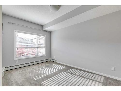 102-4150 Seton Drive Se, Calgary, AB - Indoor Photo Showing Other Room