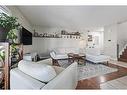 415 Midridge Drive Se, Calgary, AB  - Indoor Photo Showing Living Room 