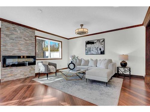 2231 Sumac Road Nw, Calgary, AB - Indoor Photo Showing Living Room With Fireplace