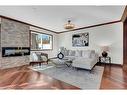 2231 Sumac Road Nw, Calgary, AB  - Indoor Photo Showing Living Room With Fireplace 