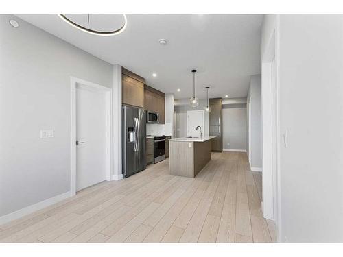 3403-111 Wolf Creek Drive Se, Calgary, AB - Indoor Photo Showing Kitchen