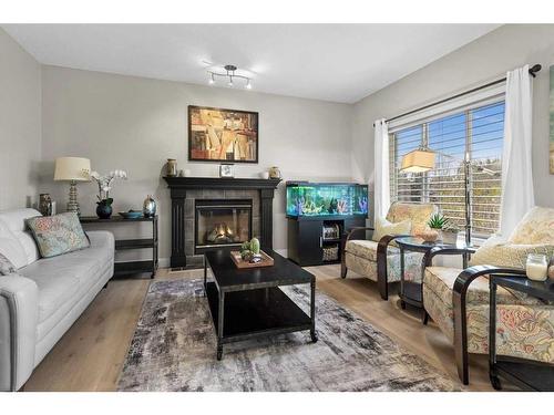 162 Rockyspring Circle Nw, Calgary, AB - Indoor Photo Showing Living Room With Fireplace