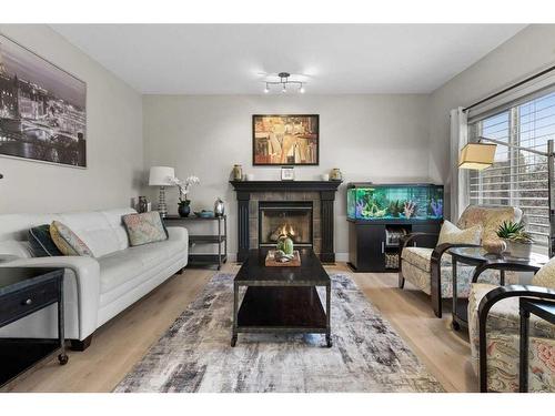 162 Rockyspring Circle Nw, Calgary, AB - Indoor Photo Showing Living Room With Fireplace