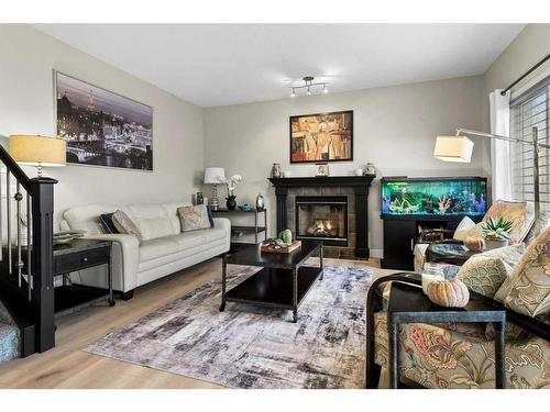 162 Rockyspring Circle Nw, Calgary, AB - Indoor Photo Showing Living Room With Fireplace