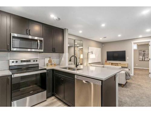 1121 Mahogany Boulevard Se, Calgary, AB - Indoor Photo Showing Kitchen With Stainless Steel Kitchen With Double Sink With Upgraded Kitchen