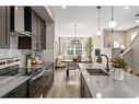 1121 Mahogany Boulevard Se, Calgary, AB  - Indoor Photo Showing Kitchen With Double Sink With Upgraded Kitchen 