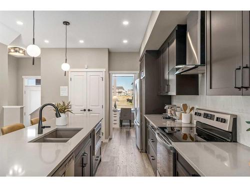 1121 Mahogany Boulevard Se, Calgary, AB - Indoor Photo Showing Kitchen With Stainless Steel Kitchen With Double Sink With Upgraded Kitchen