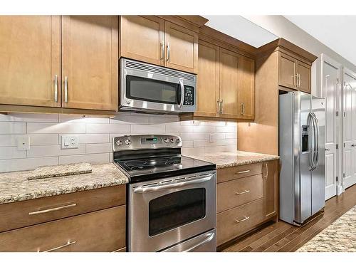 226 Quarry Park Boulevard Se, Calgary, AB - Indoor Photo Showing Kitchen With Stainless Steel Kitchen