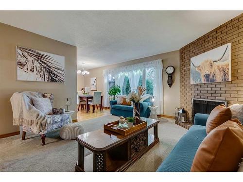 8 Dovercroft Place Se, Calgary, AB - Indoor Photo Showing Living Room With Fireplace