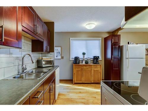 8 Dovercroft Place Se, Calgary, AB - Indoor Photo Showing Kitchen With Double Sink