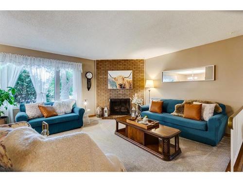 8 Dovercroft Place Se, Calgary, AB - Indoor Photo Showing Living Room With Fireplace