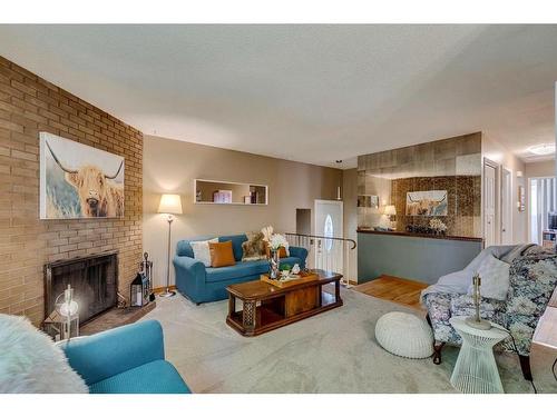 8 Dovercroft Place Se, Calgary, AB - Indoor Photo Showing Living Room With Fireplace