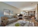 1-1927 32 Street Sw, Calgary, AB  - Indoor Photo Showing Living Room 