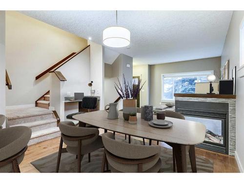 1-1927 32 Street Sw, Calgary, AB - Indoor Photo Showing Dining Room With Fireplace