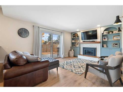 52 Lake Crimson Close Se, Calgary, AB - Indoor Photo Showing Living Room With Fireplace