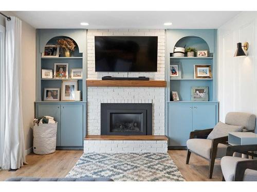 52 Lake Crimson Close Se, Calgary, AB - Indoor Photo Showing Living Room With Fireplace