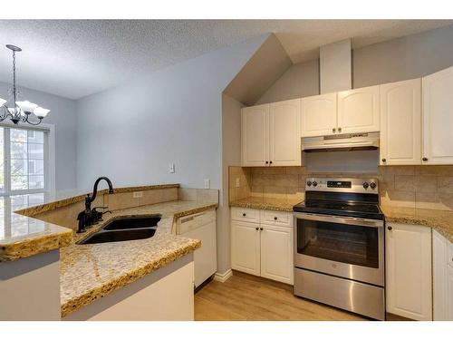 103-44 6A Street Ne, Calgary, AB - Indoor Photo Showing Kitchen With Double Sink