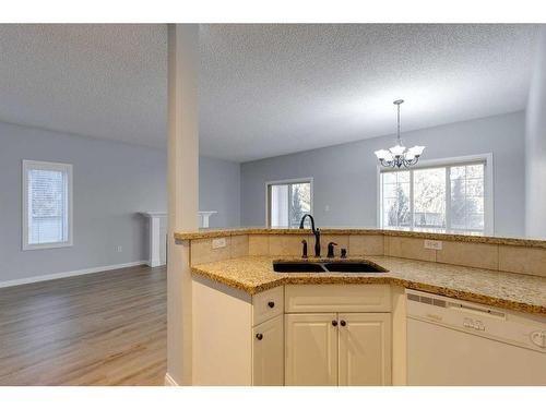 103-44 6A Street Ne, Calgary, AB - Indoor Photo Showing Kitchen With Double Sink