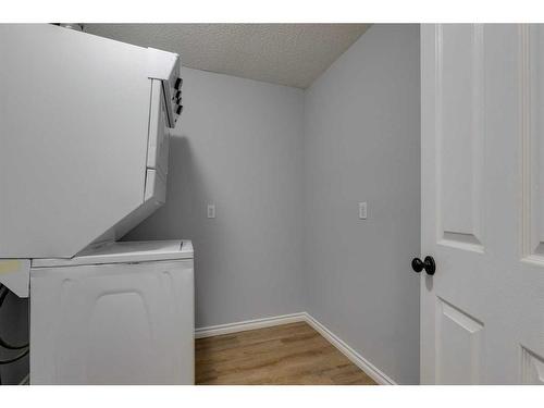 103-44 6A Street Ne, Calgary, AB - Indoor Photo Showing Laundry Room