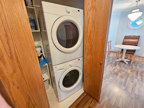 Unit #1-26 Quigley Drive, Cochrane, AB - Indoor Photo Showing Laundry Room