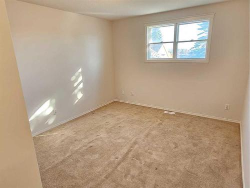 Unit #1-26 Quigley Drive, Cochrane, AB - Indoor Photo Showing Other Room