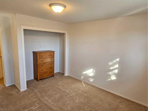 Unit #1-26 Quigley Drive, Cochrane, AB - Indoor Photo Showing Other Room