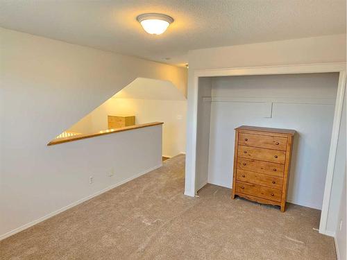 Unit #1-26 Quigley Drive, Cochrane, AB - Indoor Photo Showing Other Room