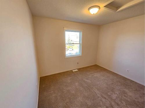 Unit #1-26 Quigley Drive, Cochrane, AB - Indoor Photo Showing Other Room