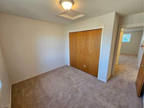 Unit #1-26 Quigley Drive, Cochrane, AB - Indoor Photo Showing Other Room