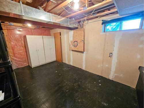 Unit #1-26 Quigley Drive, Cochrane, AB - Indoor Photo Showing Basement