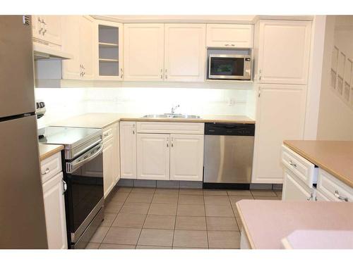 24-164 Rundle Drive, Canmore, AB - Indoor Photo Showing Kitchen With Stainless Steel Kitchen With Double Sink