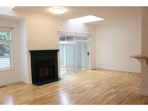 24-164 Rundle Drive, Canmore, AB - Indoor Photo Showing Living Room With Fireplace