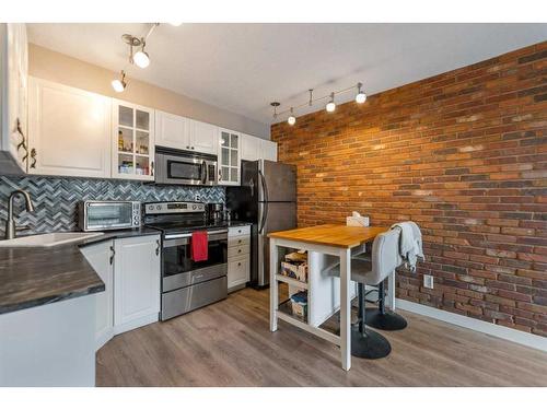 8-2902 17 Avenue Sw, Calgary, AB - Indoor Photo Showing Kitchen With Stainless Steel Kitchen