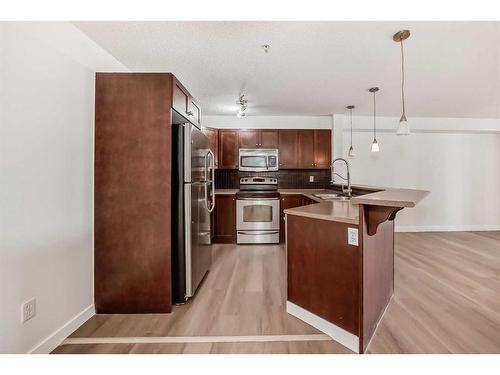 3205-60 Panatella Street Nw, Calgary, AB - Indoor Photo Showing Kitchen With Stainless Steel Kitchen