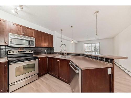 3205-60 Panatella Street Nw, Calgary, AB - Indoor Photo Showing Kitchen With Stainless Steel Kitchen With Double Sink