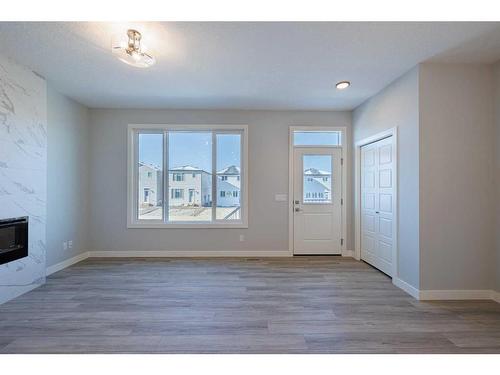 231 Cornerbrook Road Ne, Calgary, AB - Indoor With Fireplace