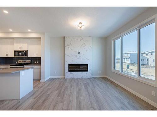 231 Cornerbrook Road Ne, Calgary, AB - Indoor With Fireplace