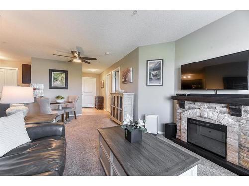 2332-81 Legacy Boulevard Se, Calgary, AB - Indoor Photo Showing Living Room With Fireplace