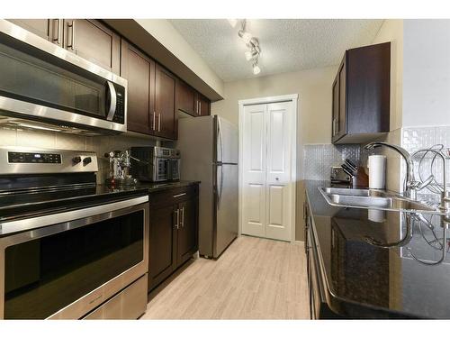 2332-81 Legacy Boulevard Se, Calgary, AB - Indoor Photo Showing Kitchen With Double Sink