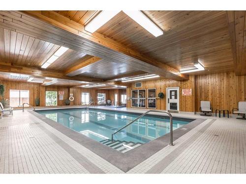 427-8535 Bonaventure Drive Se, Calgary, AB - Indoor Photo Showing Other Room With In Ground Pool