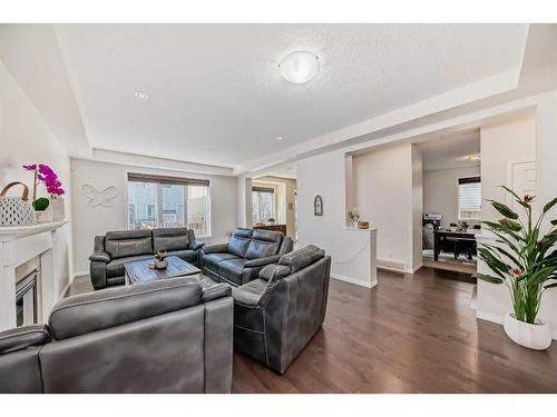 158 Windridge Road Sw, Airdrie, AB - Indoor Photo Showing Living Room With Fireplace